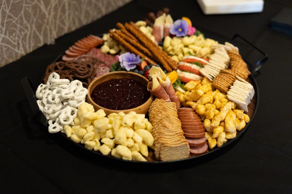 Beautifully arranged wedding charcuterie board featuring cheeses, meats, crackers, and fruit, perfect for Wisconsin