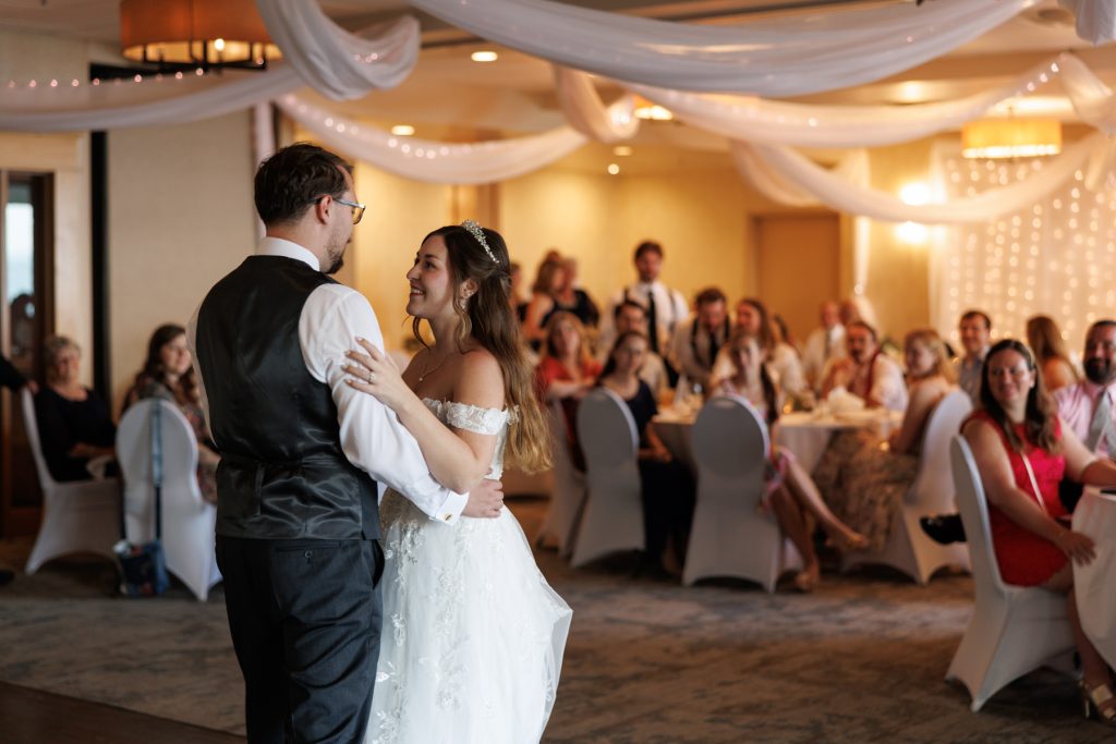 Bride and groom share a romantic first dance at a Wisconsin wedding reception, captured
