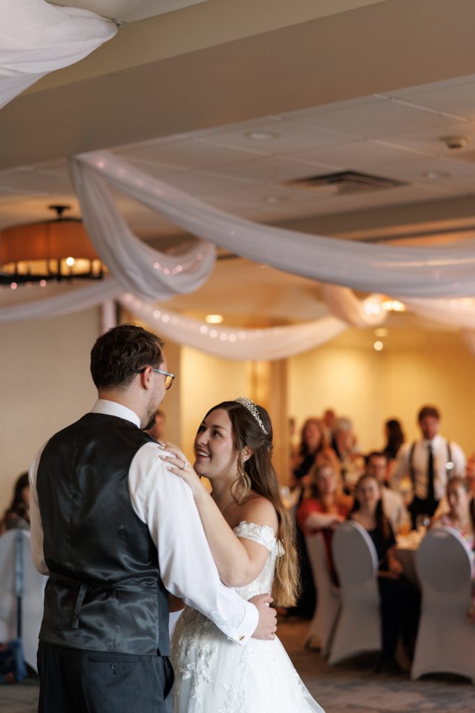 Bride and groom share a romantic first dance at a Wisconsin wedding reception, captured