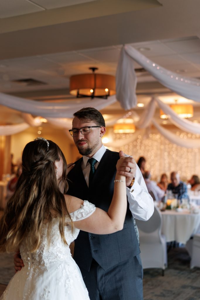 Bride and groom sharing a first dance at a Wisconsin wedding reception, captured by Beau