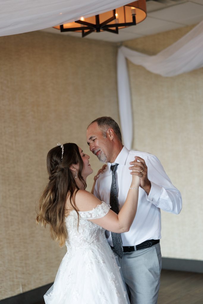 Bride and father sharing a tender dance moment at a Wisconsin wedding, captured by Beau