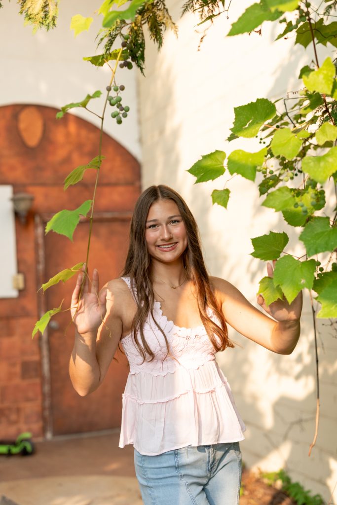 Hayward, Wisconsin high school senior Abby poses for a portrait session with Superior Sunset Studio