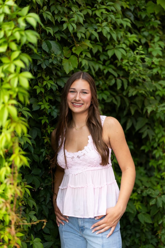 Hayward Wisconsin High School senior Abby smiling for her portrait session, captured by Superior Sunset