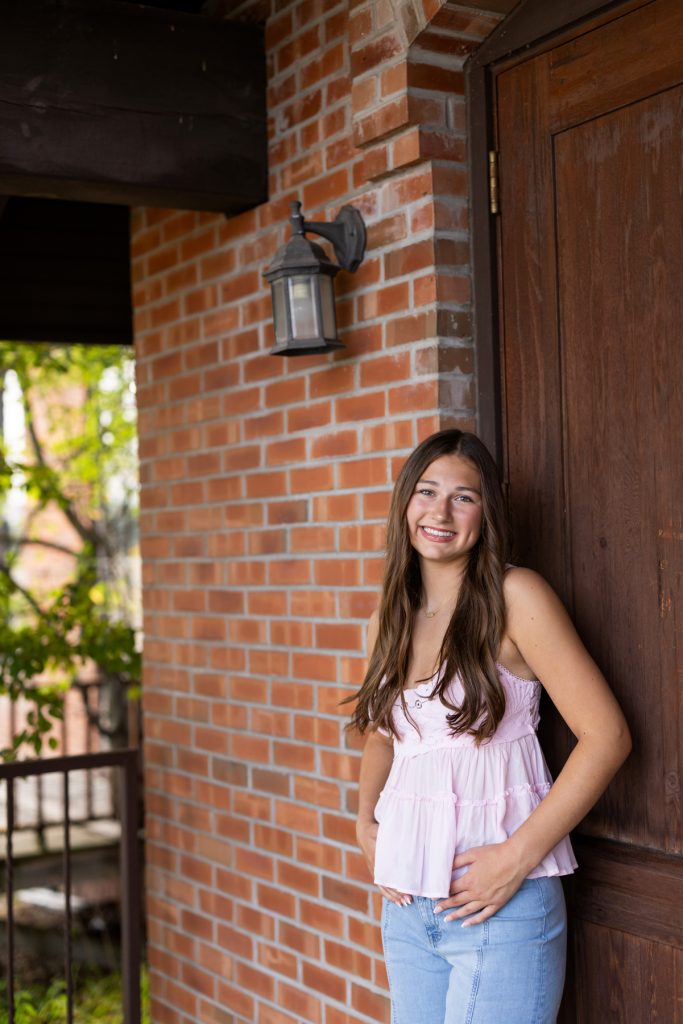 Hayward Wisconsin High School senior Abby smiling for her portrait session, captured by Superior Sunset