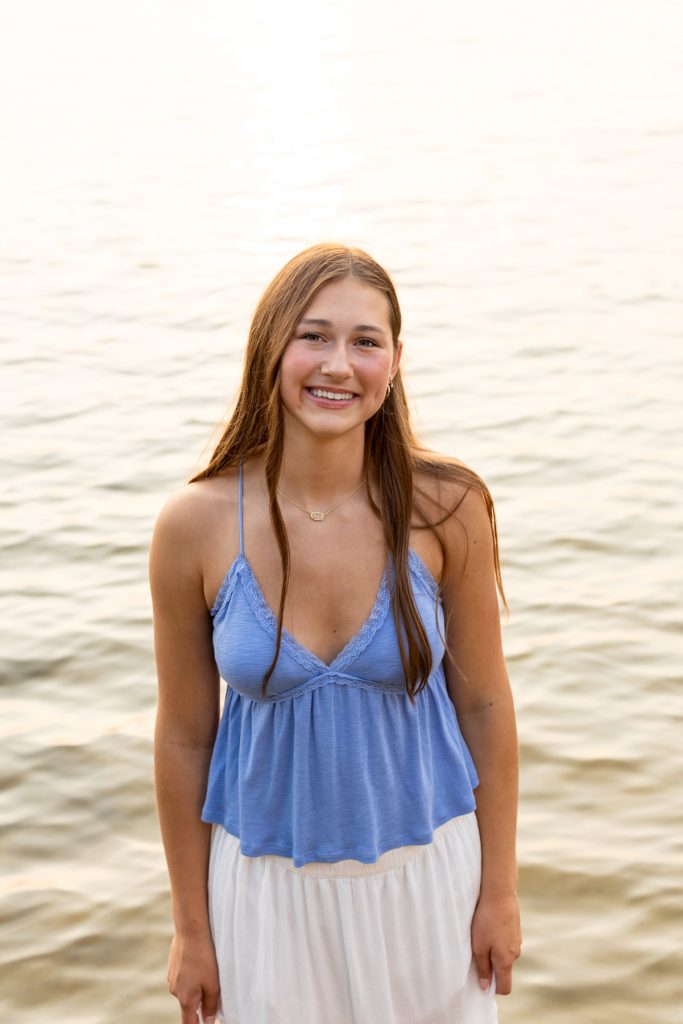 Hayward Wisconsin High School senior Abby smiles warmly in a portrait session by Superior Sunset