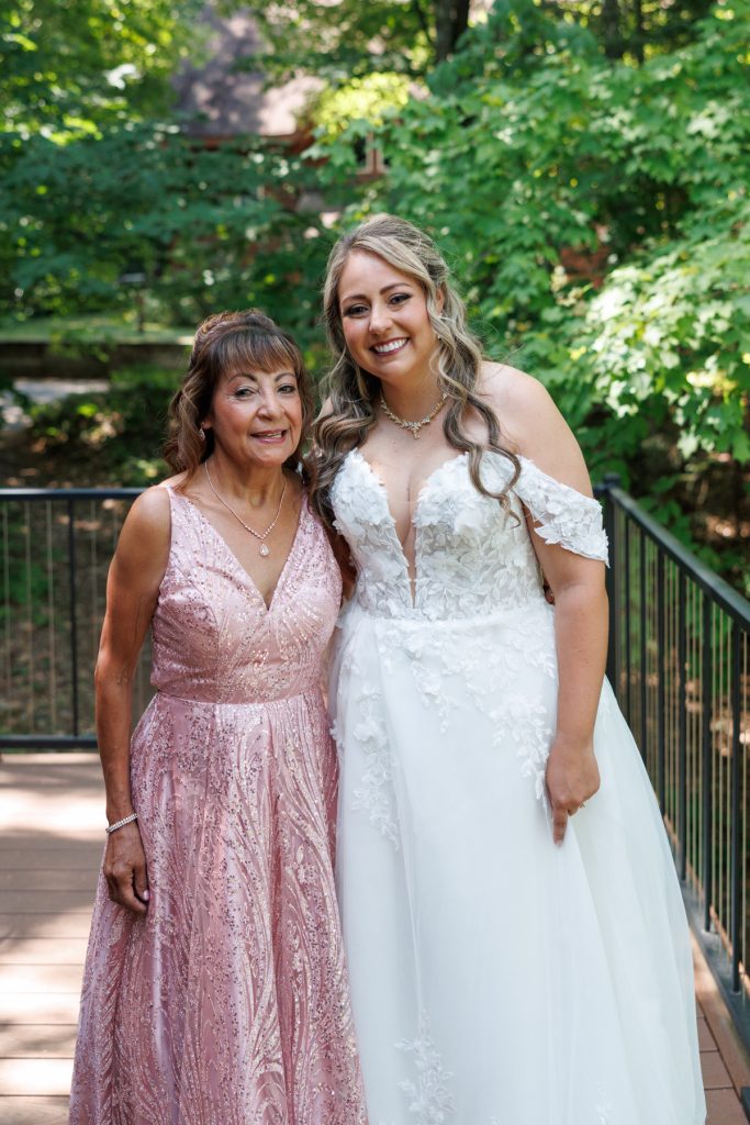Bride and mother share a joyful moment at a Lakewoods Resort wedding in Cable, Wisconsin