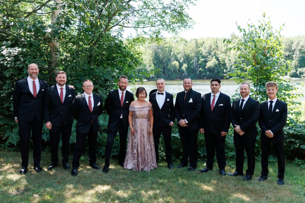 Groom and groomsmen posing with mother of the bride at Lakewoods Resort wedding in Cable