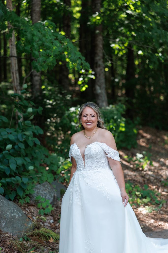 Bride Bianca smiles radiantly in a detailed off-the-shoulder wedding gown, captured by Beau Petersen Photography
