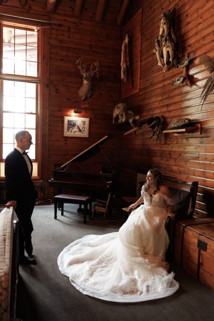 Bianca in her wedding gown and Nick in a tuxedo gaze at each other