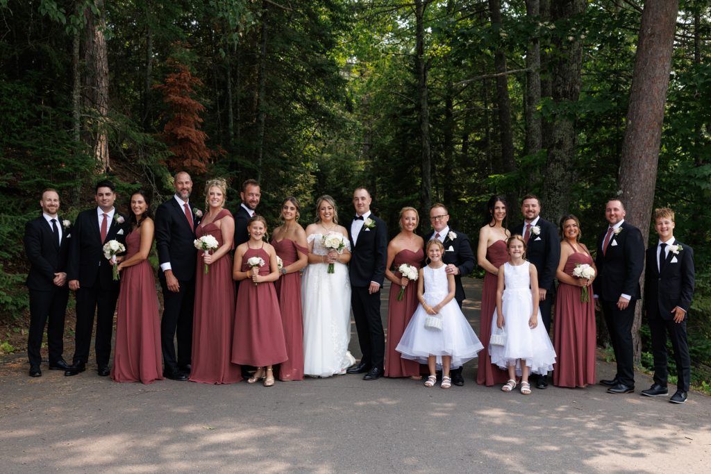 Large group portrait of Bianca and Nick's wedding party at Lakewoods Resort in Cable, Wisconsin