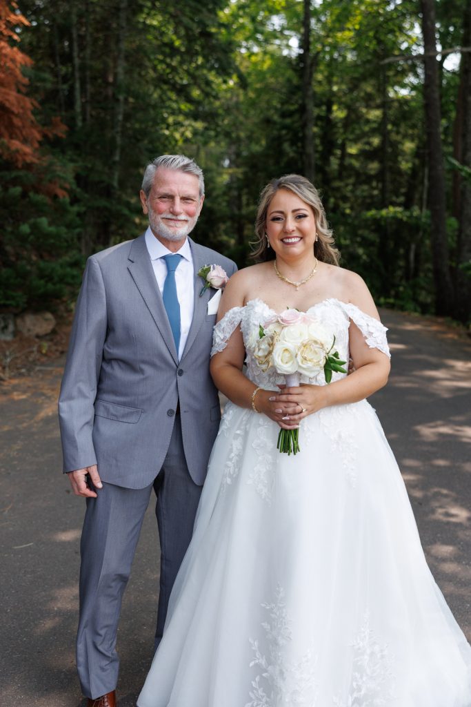 Bride and groom with groom's father at a Lakewoods Resort wedding in Cable, Wisconsin, captured