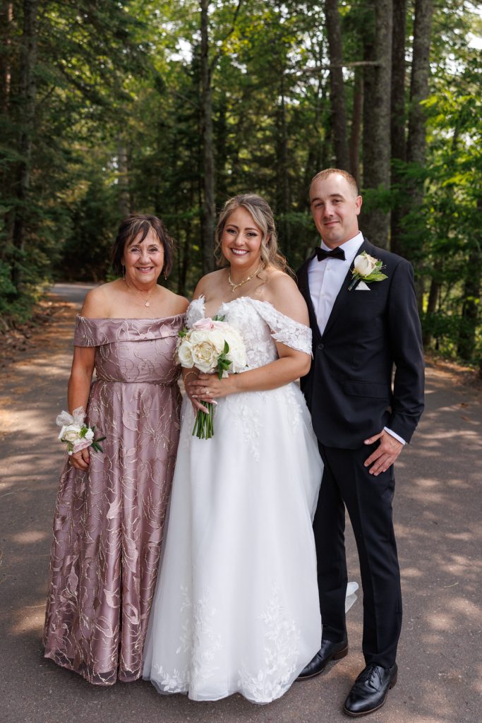 Bianca, the bride, poses with her mother and Nick, the groom, at a Lakewoods Resort