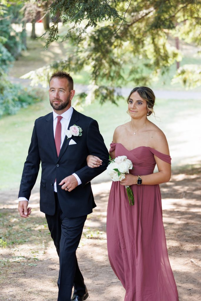 Bianca and Nick, the couple featured in this Lakewoods Resort wedding photography, walk hand-in-hand