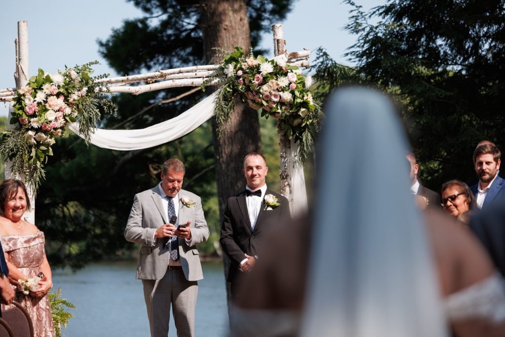 Bride and groom awaiting ceremony at Lakewoods Resort wedding in Cable, Wisconsin, captured by Beau