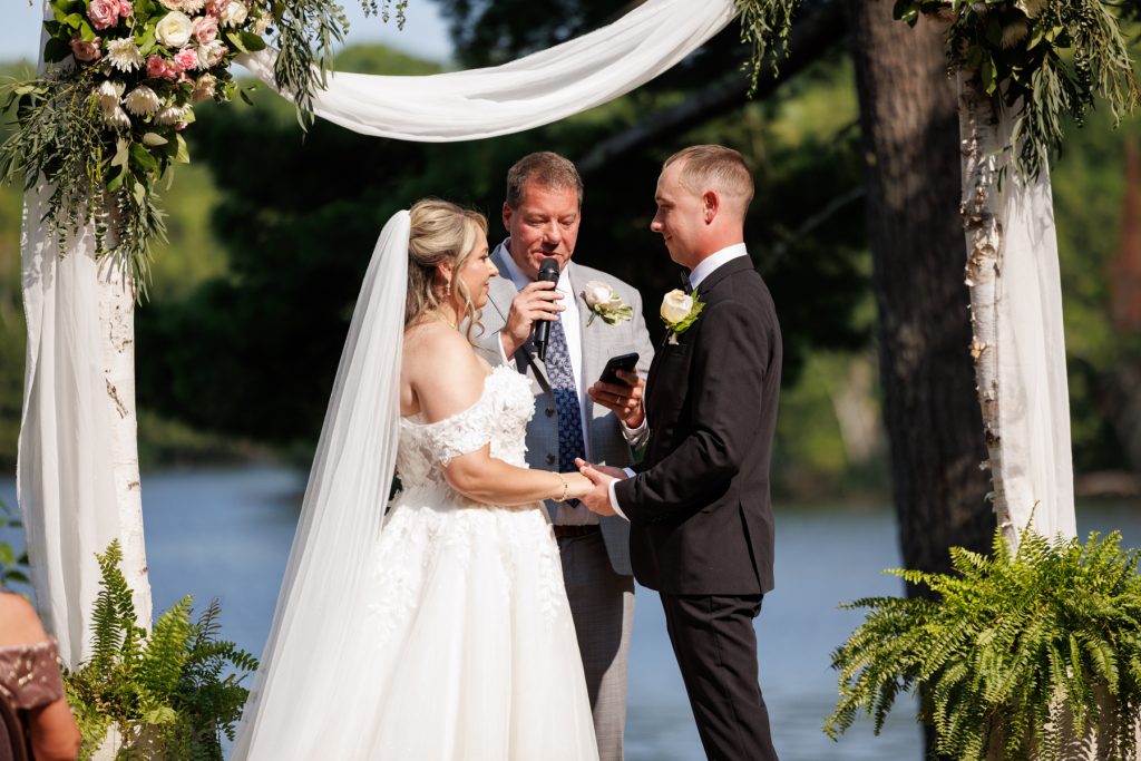 Bianca and Nick exchange vows at their Lakewoods Resort wedding in Cable, Wisconsin, captured