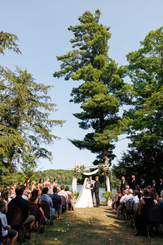 Bianca and Nick’s Lakewoods Resort wedding ceremony in Cable, Wisconsin, captured by Beau Petersen Photography
