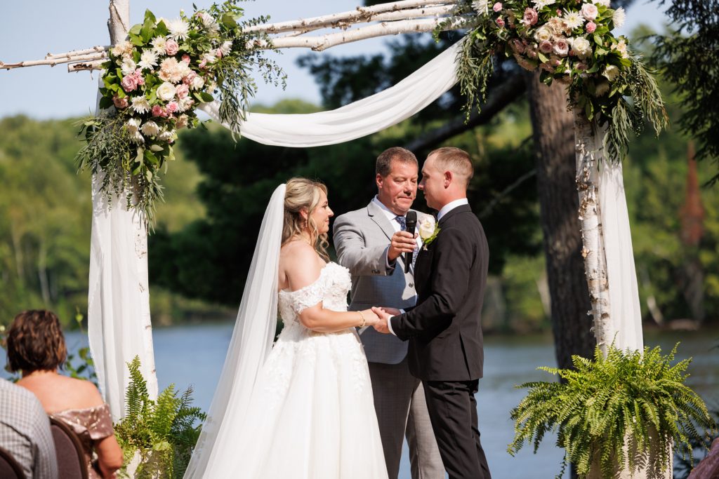 Bianca and Nick exchange vows at their Lakewoods Resort wedding in Cable, Wisconsin, captured