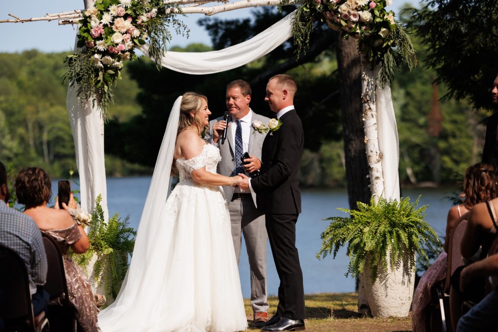 Bianca and Nick exchange vows during their Lakewoods Resort wedding ceremony in Cable, Wisconsin, captured