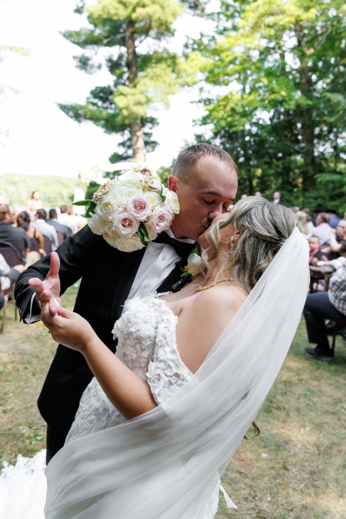 Bianca and Nick share a joyful first kiss as newlyweds during their destination wedding