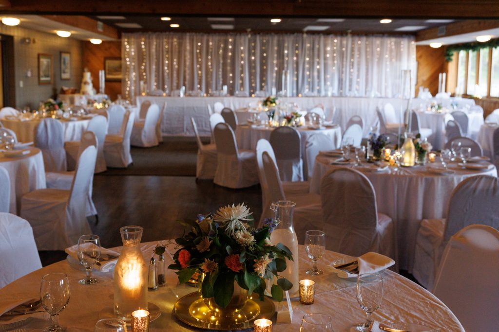 Beautifully decorated reception hall at Lakewoods Resort in Cable, Wisconsin, showcasing wedding photography and videography