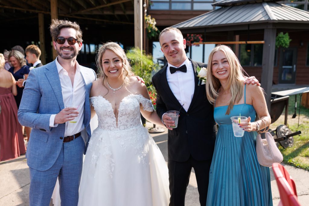 Bianca and Nick, the Lakewoods Resort wedding couple, pose with friends at their destination wedding