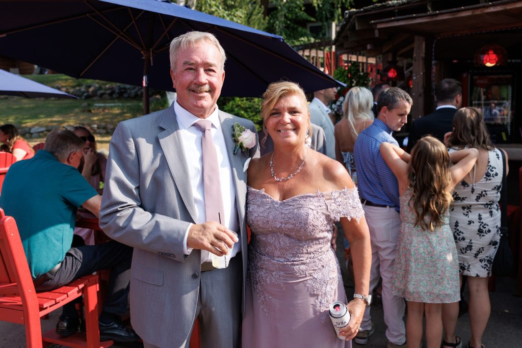 Couple posing for a photograph at a Lakewoods Resort wedding in Cable, Wisconsin, captured