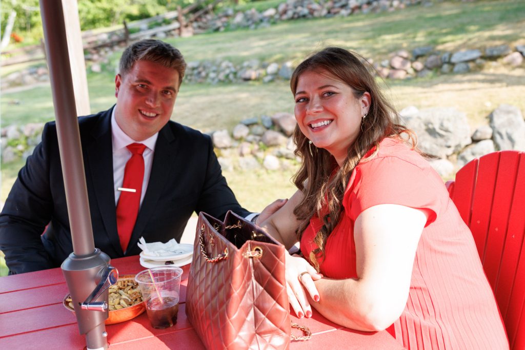 Bianca and Nick, the happy couple, smiling and enjoying time together at their Lakewoods Resort
