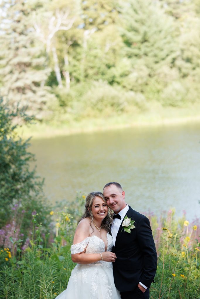 Bianca and Nick, the happy couple, pose for a portrait near Lake Namekagon