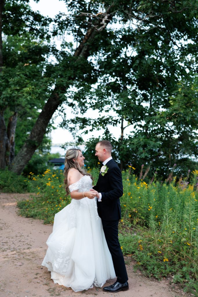 Bianca and Nick, the newlyweds, share a tender moment during their destination wedding at Lakewoods