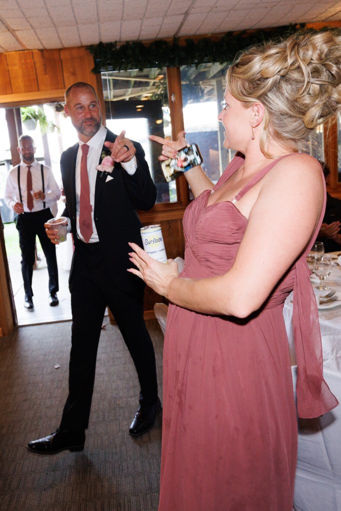Bride and groom playfully interact with guests during their Lakewoods Resort wedding in Cable, Wisconsin