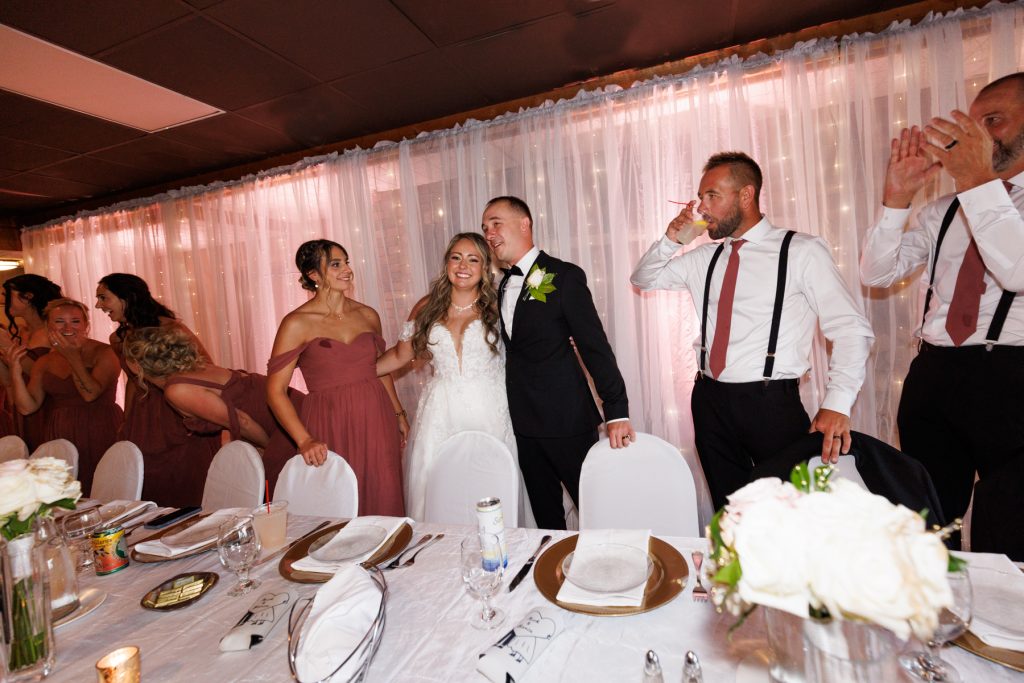 Bianca and Nick, the newlyweds, celebrate with their wedding party at Lakewoods Resort in Cable