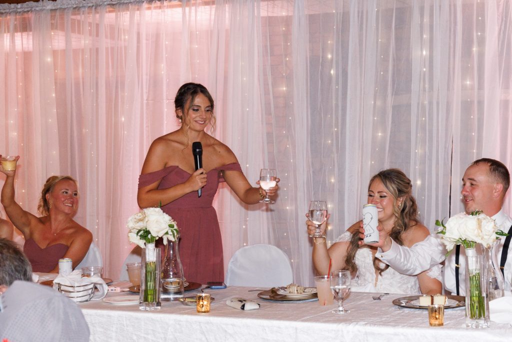 Bride and guests at a Lakewoods Resort wedding in Cable, Wisconsin, celebrating with drinks