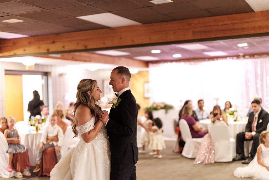 Bianca and Nick share a romantic first dance at their Lakewoods Resort wedding in Cable