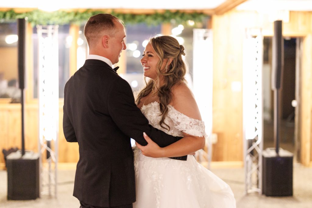 Bianca and Nick share a joyful first dance at their destination wedding at Lakewoods Resort