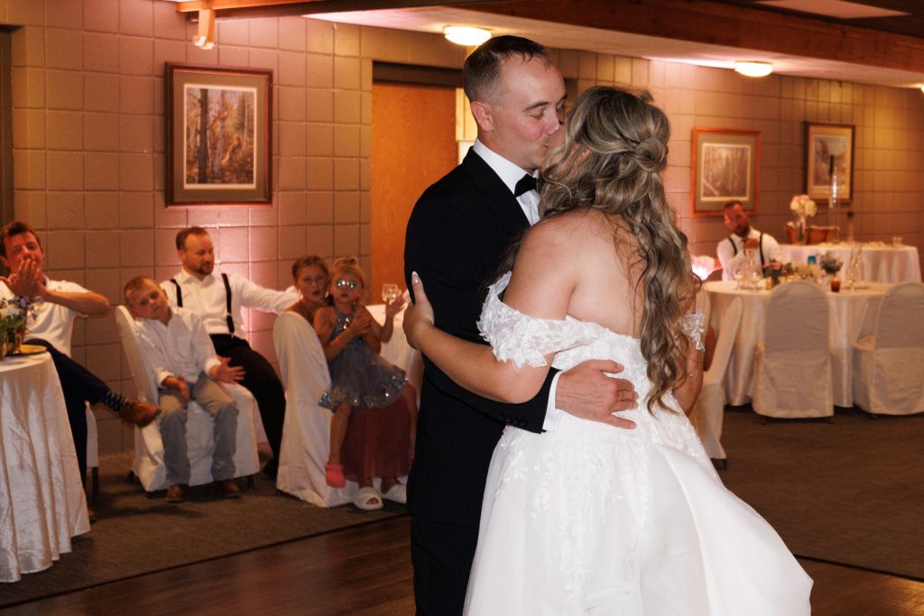 Bride and groom share a romantic first dance at Lakewoods Resort wedding in Cable, Wisconsin