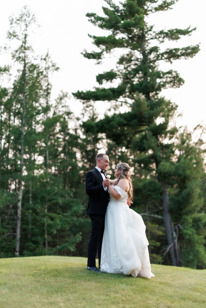 Bianca and Nick, the newlyweds, share a tender moment captured by Beau Petersen Photography