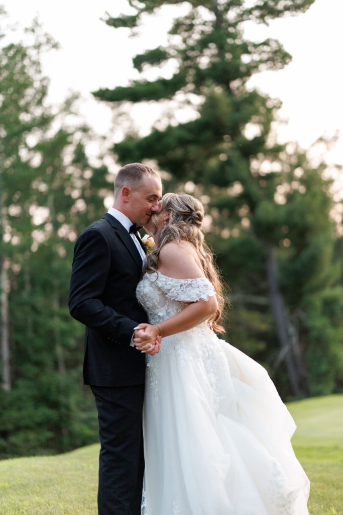 Bianca and Nick share a tender moment during their Lakewoods Resort wedding in Cable, Wisconsin