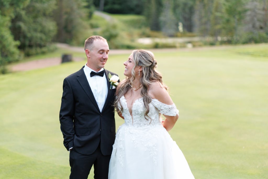 Bianca and Nick, the happy couple, share a joyful moment at their Lakewoods Resort wedding