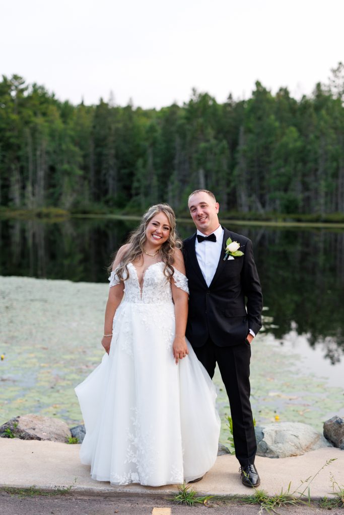Bianca and Nick, the happy couple, pose for wedding photography at Lakewoods Resort in Cable