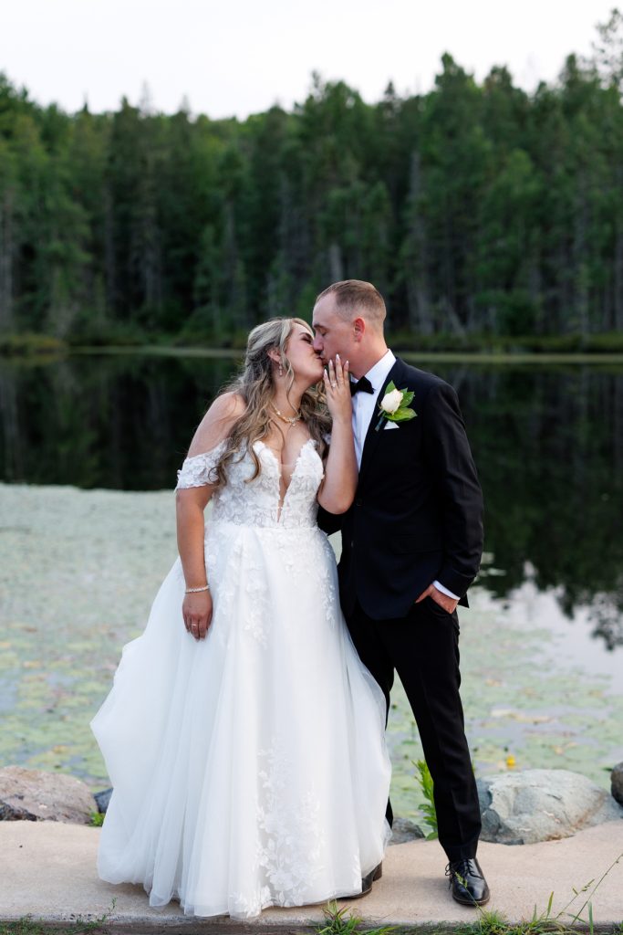 Bianca and Nick share a romantic kiss during their Lakewoods Resort wedding photography session, captured