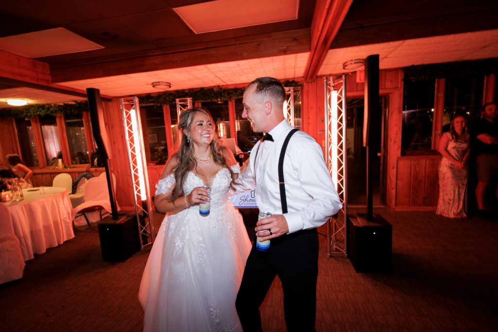 Bianca and Nick, the newlyweds, share a joyful dance at their Lakewoods Resort wedding