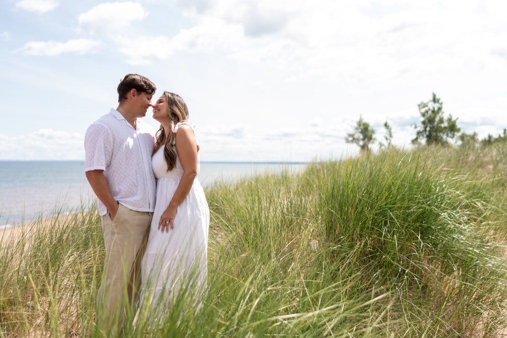 Cassie and Daniel share a tender moment during their engagement photography session near Bayfield