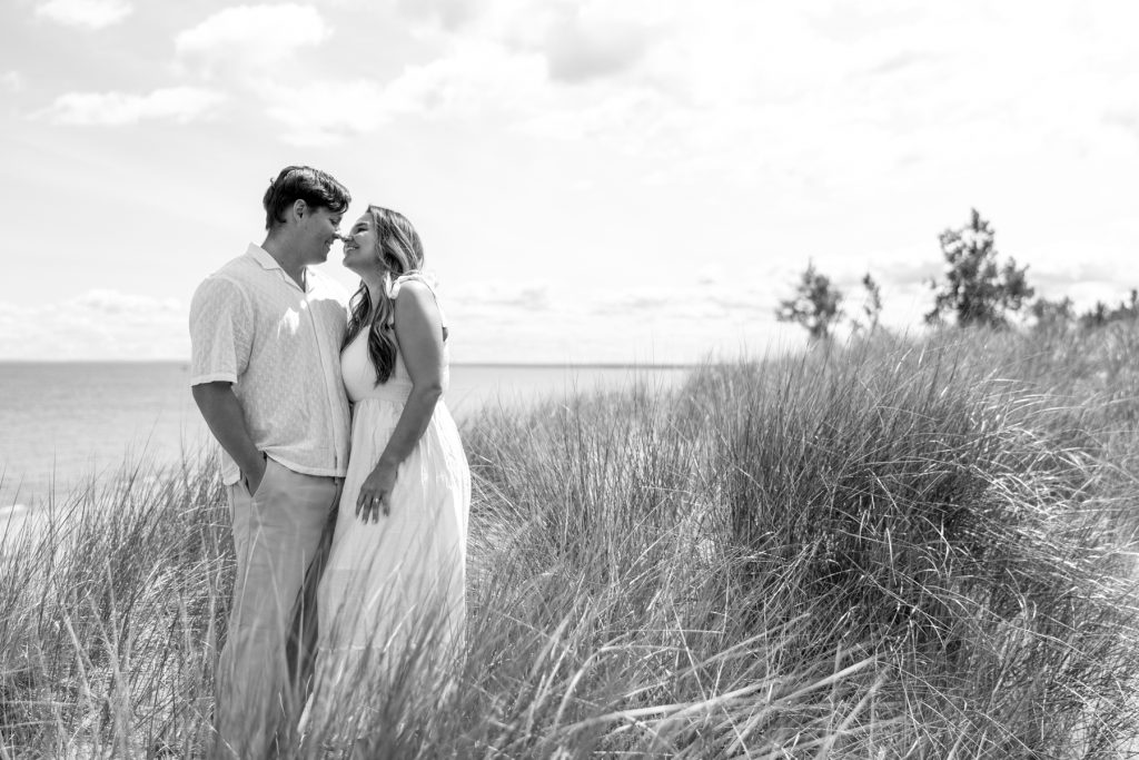 Cassie and Daniel share a tender moment during their engagement session near Lake Superior