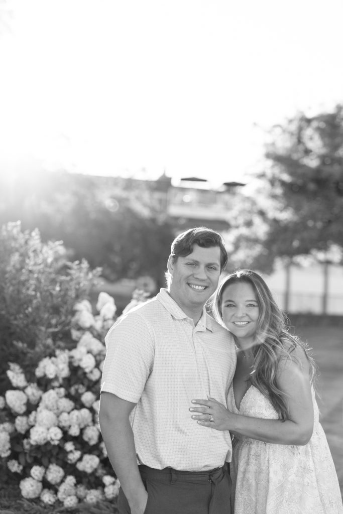 Cassie and Daniel, the engaged couple, smiling warmly during their engagement photography session near Duluth